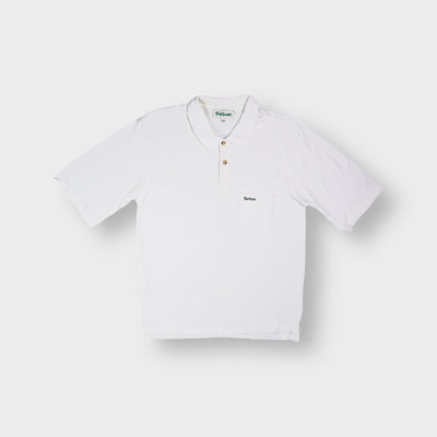Barbour short-sleeved white polo shirt with green embroidered logo on the chest pocket.