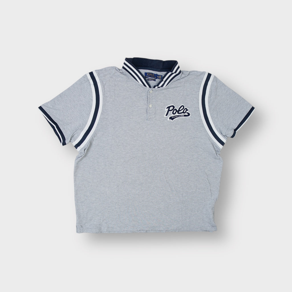 Ralph Lauren grey polo shirt featuring a navy script patch and striped collar trim