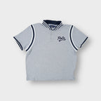 Ralph Lauren grey polo shirt featuring a navy script patch and striped collar trim