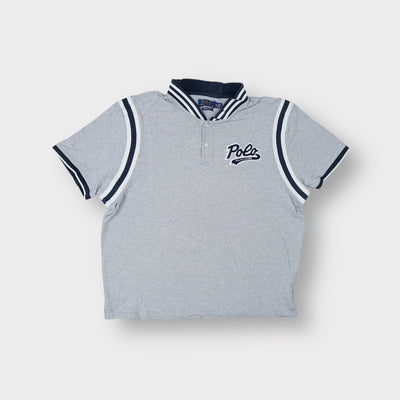 Ralph Lauren grey polo shirt featuring a navy script patch and striped collar trim