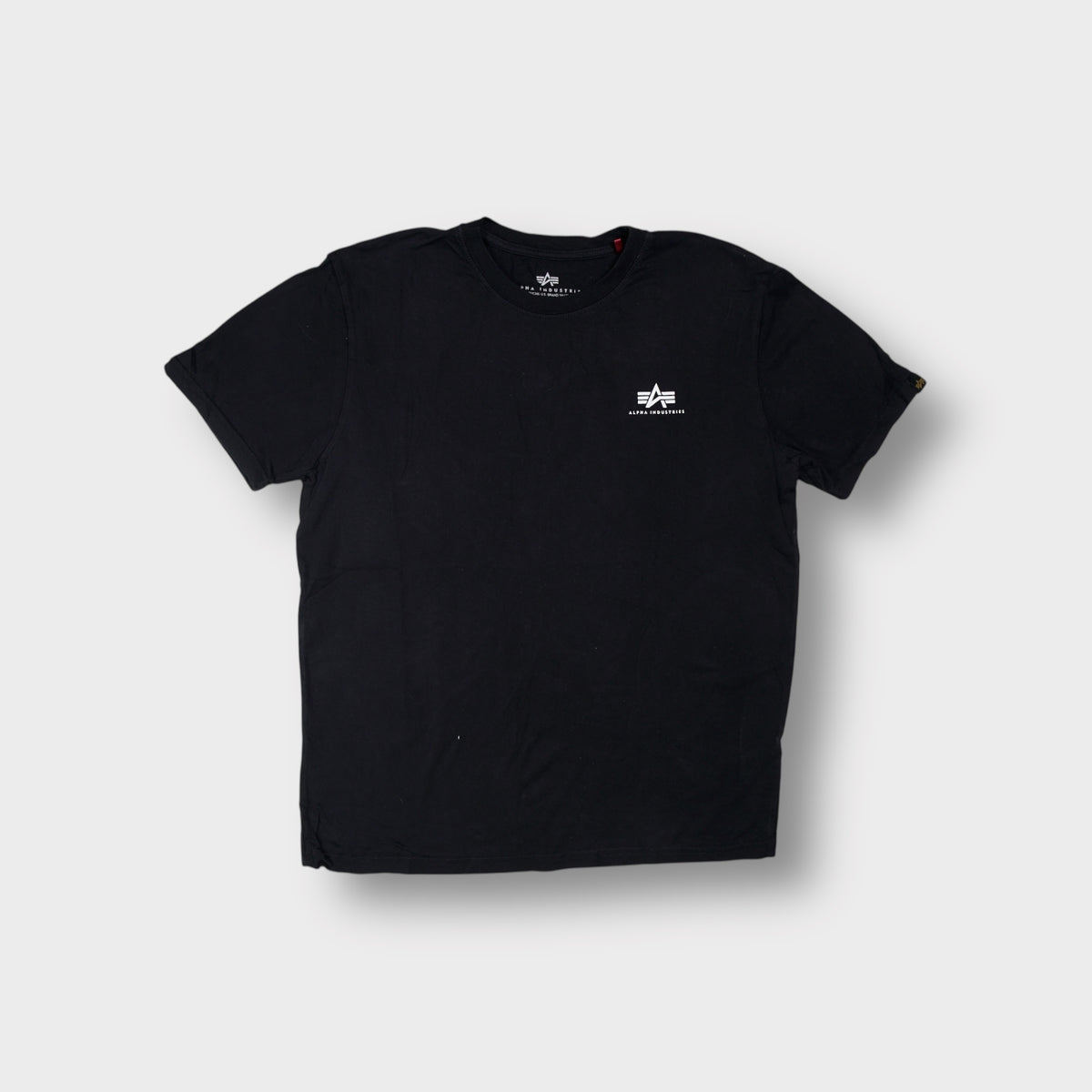 Alpha Industries black T-Shirt featuring a small white logo printed on the chest