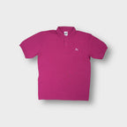 Puma short-sleeve polo shirt in pink featuring an embroidered white cat logo on chest.