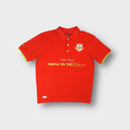 Kappa polo shirt in red featuring an embroidered Victory chest crest and front text.