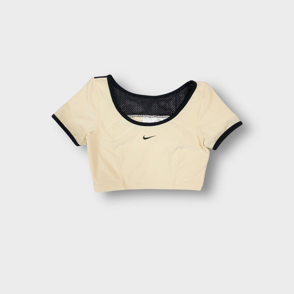 Nike crop top in light yellow featuring black trim details and small center swoosh logo