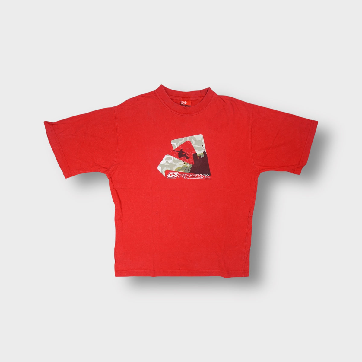 Rip Curl T-Shirt in red with a printed skate graphic design across the front chest.