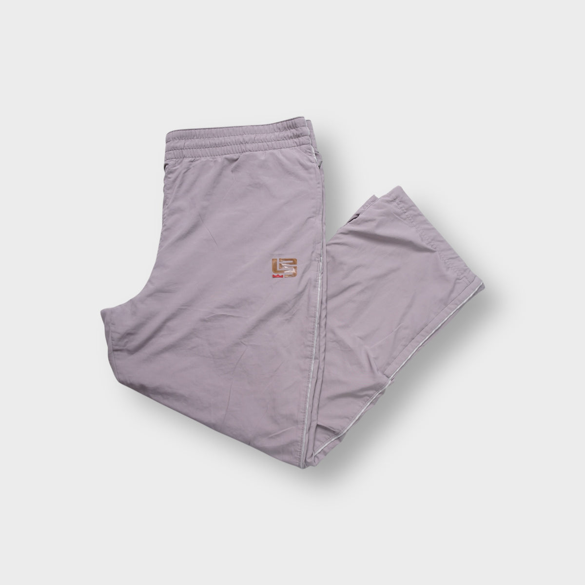 Nike LeBron James trackpants in grey with bronze L23 logo embroidered on the thigh