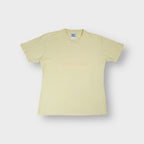 Yellow Reebok V-neck T-Shirt featuring a small embroidered logo on the chest