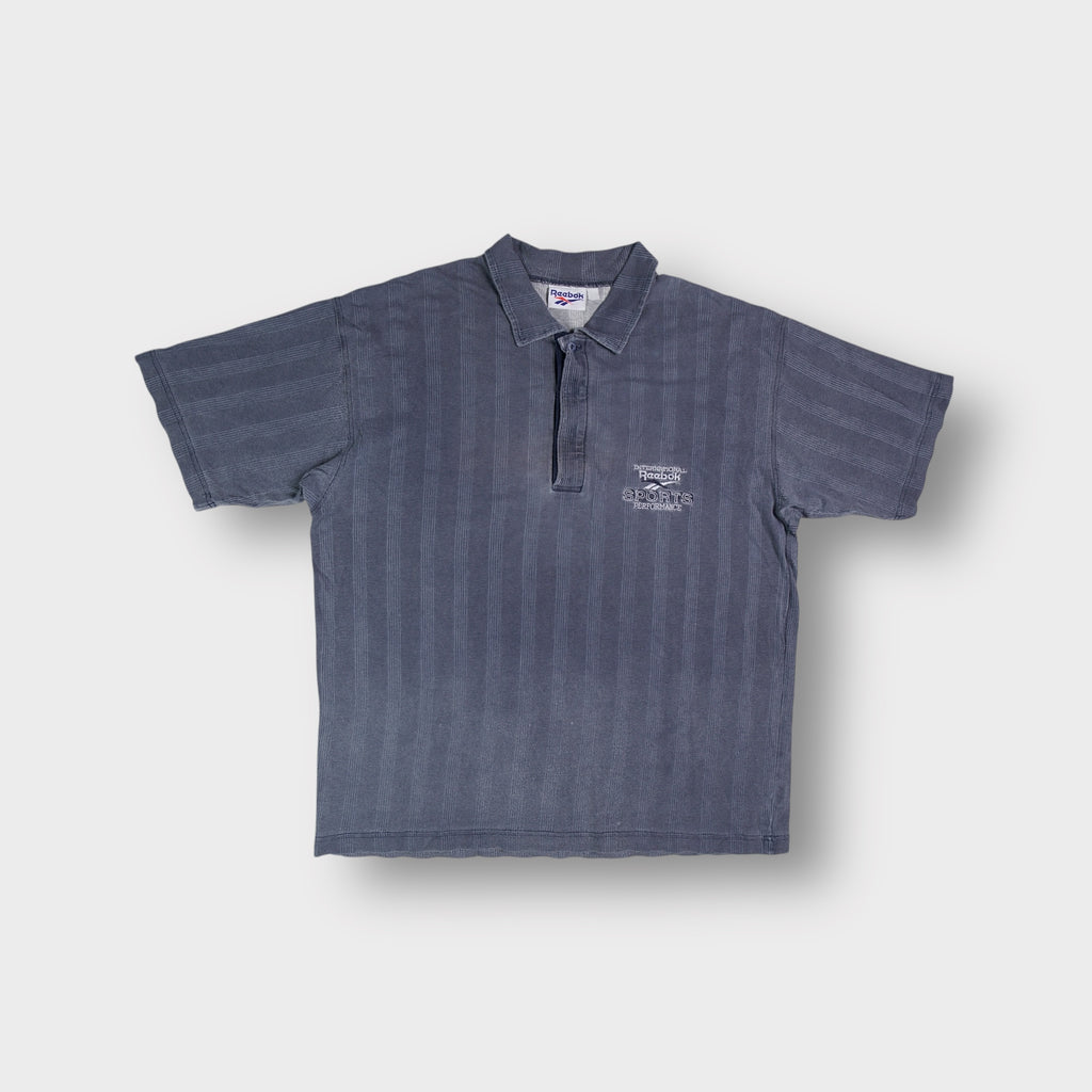 Grey Reebok short sleeve polo shirt with embroidered International Sports Performance logo
