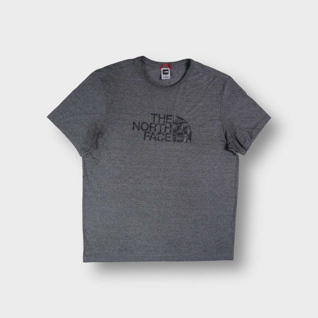 The North Face T-Shirt in heather grey with a dark raised logo print across the chest