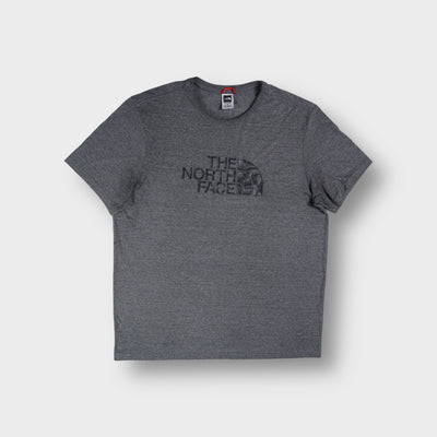 The North Face T-Shirt in heather grey with a dark raised logo print across the chest