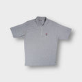 Grey Fila polo shirt with a half-zip placket and embroidered chest logo