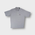 Grey Fila polo shirt with a half-zip placket and embroidered chest logo