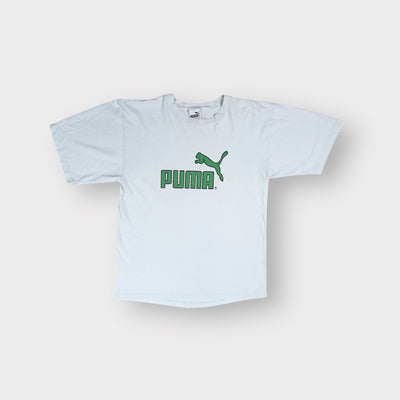 Puma short-sleeve T-shirt in white featuring a green printed cat logo on the chest.
