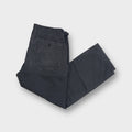 Stone Island blue pants featuring side zip pockets and a woven inner waistband tag