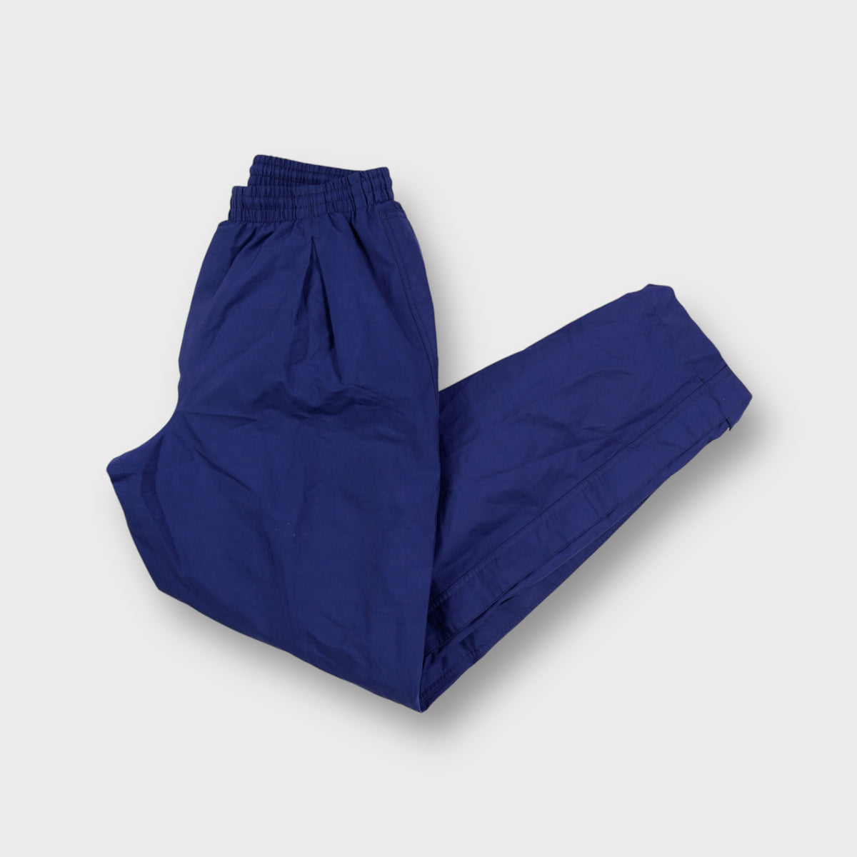 Nike blue trackpants featuring Storm-F.I.T. Rubber patch on the lower hem
