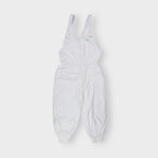 Adidas white dungarees featuring an embroidered teal Trefoil chest logo