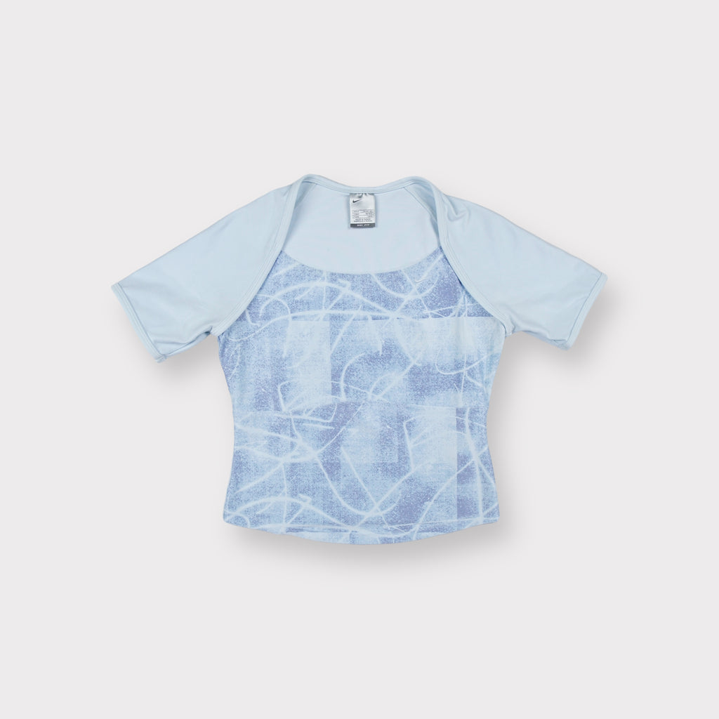 Nike short-sleeve shirt in light blue with an abstract printed panel on the front.