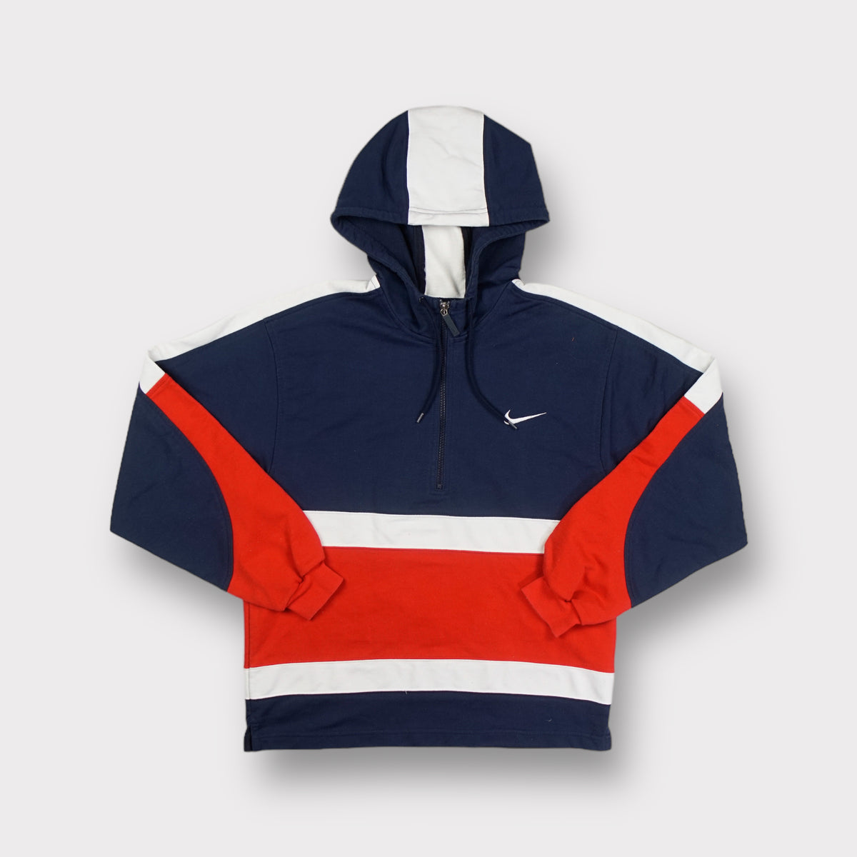 Navy Blue Nike half-zip hoodie with embroidered swoosh and red color-blocking
