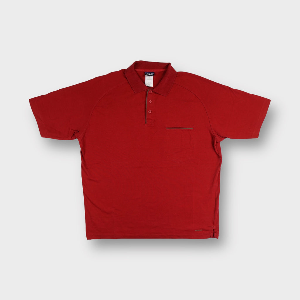 Patagonia short-sleeve polo shirt in red featuring a chest pocket and button placket
