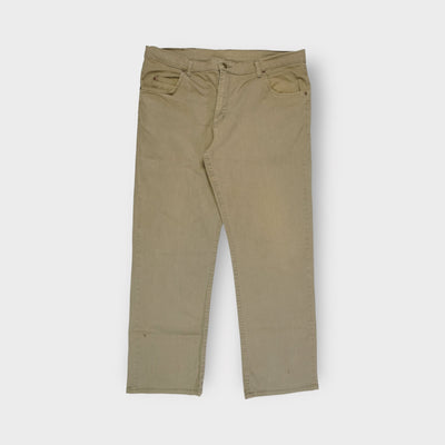 Lee khaki jeans featuring a brown leather logo patch on the back waistband