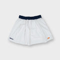 Ellesse tennis skirt in white with dark blue waistband and lower hem logo patches