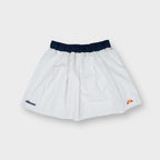 Ellesse tennis skirt in white with dark blue waistband and lower hem logo patches
