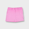 Pink Nike Golf skort with front double-button closure and small embroidered Swoosh on back