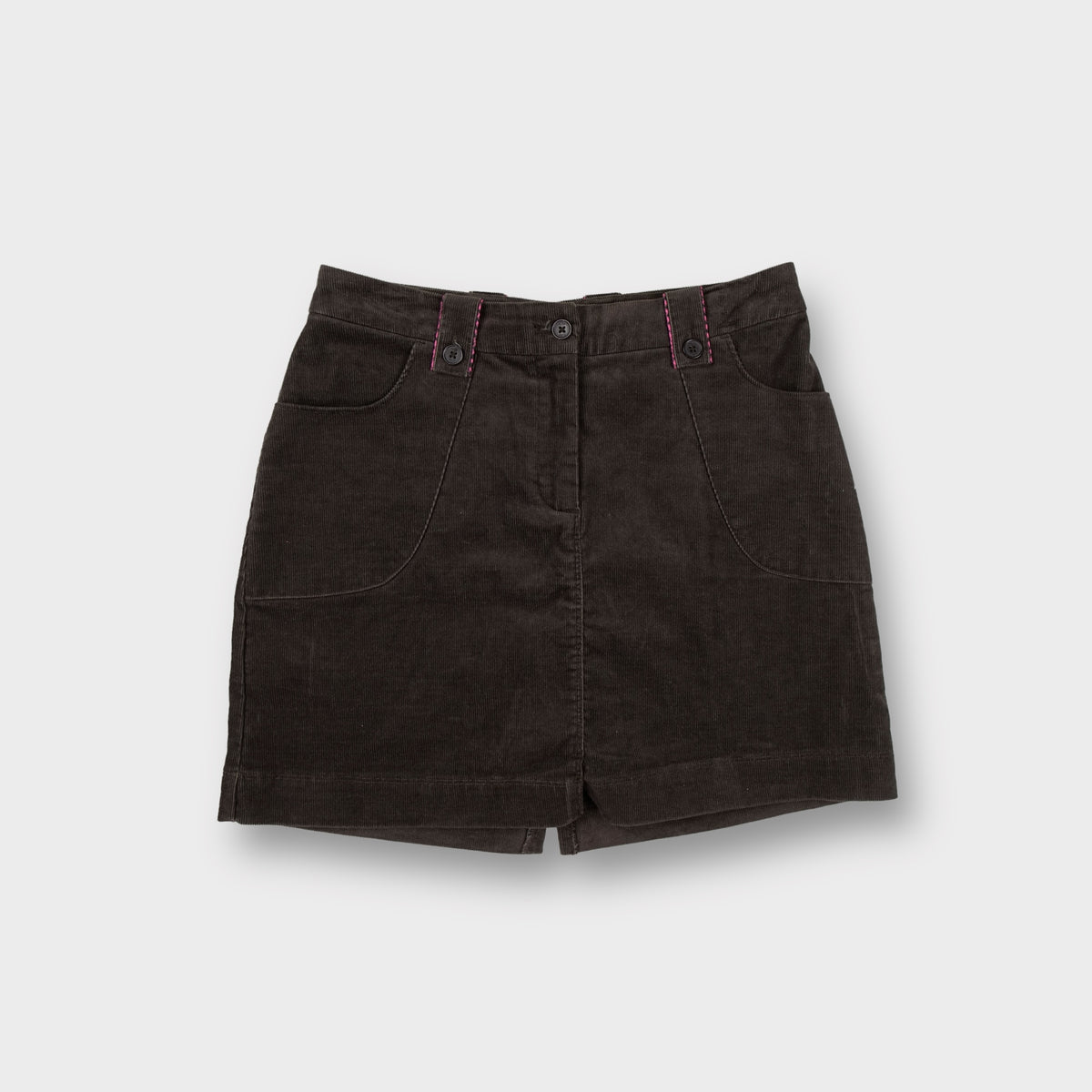 Brown Nike corduroy mini skirt showing pink stitched trim and back swoosh logo