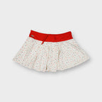 Lacoste white polka dot skirt with red waistband and embroidered crocodile logo