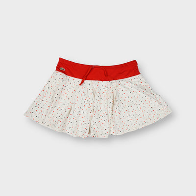 Lacoste white polka dot skirt with red waistband and embroidered crocodile logo