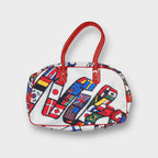 Nike 1984 Olympic Games bag in white with red handles and national flag script graphic.