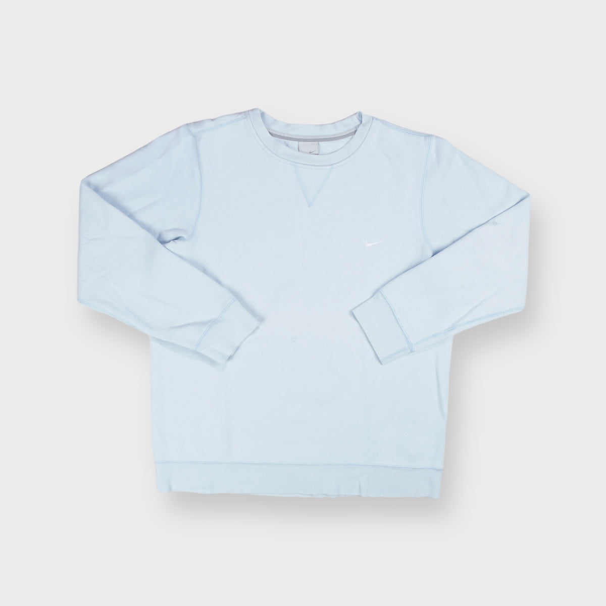 Nike crewneck sweater in light blue with small white embroidered swoosh on chest