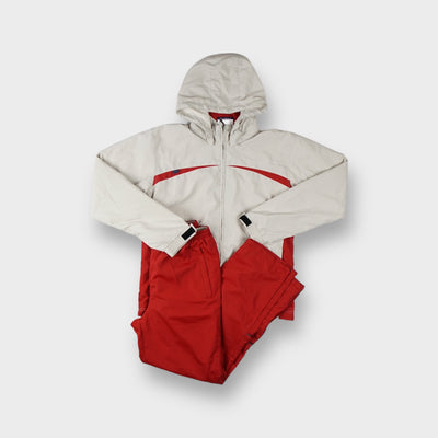 Umbro tracksuit in red and beige featuring a hooded zip jacket and track pants