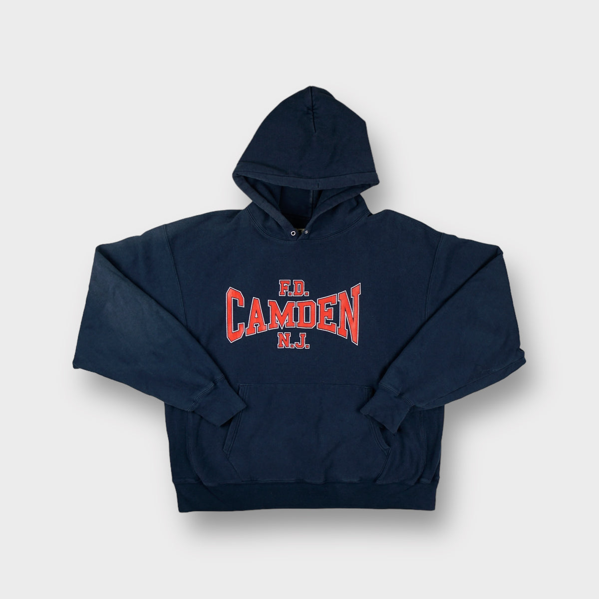 Champion hoodie in navy blue with red F.D. Camden N.J. Printed across the chest