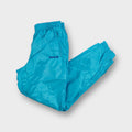 Adidas track pants in bright turquoise featuring an embroidered purple trefoil logo