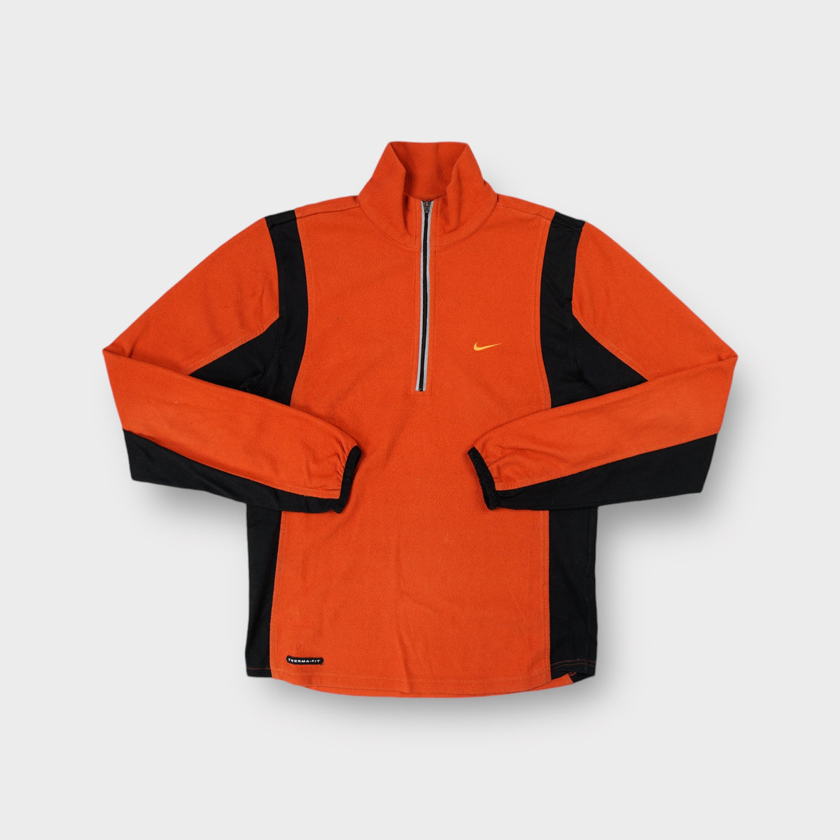 Nike fleece sweater in orange and black with a half-zip collar and small chest swoosh logo