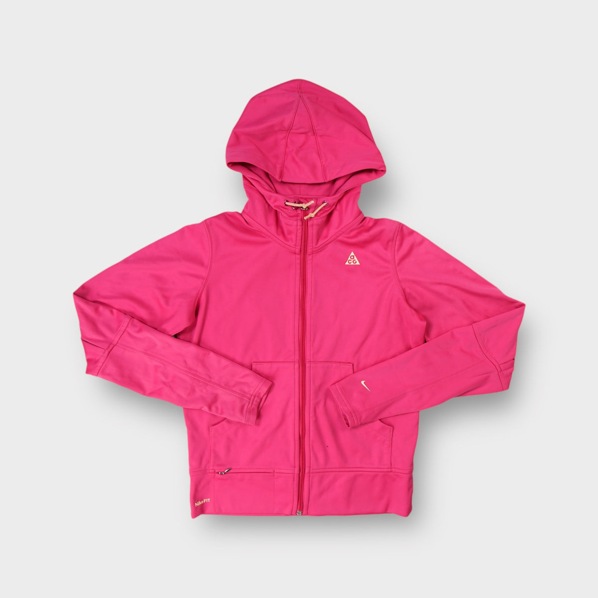 Pink Nike ACG zip hoodie with small printed logo on the chest