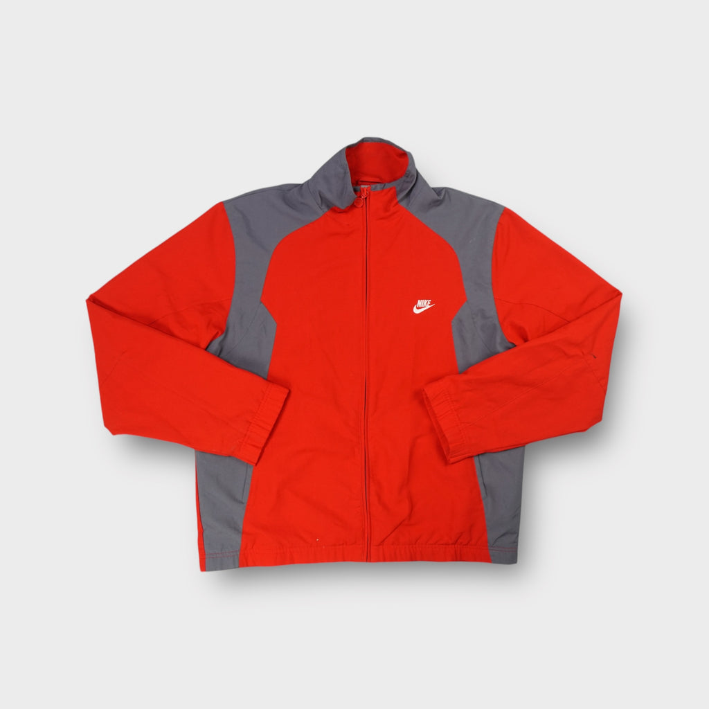 Nike track jacket in red and grey featuring an embroidered white logo on the chest.