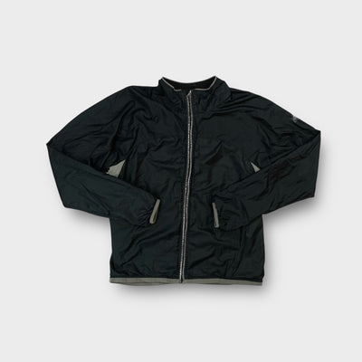 Black Nike ACG full-zip track jacket with grey contrast trim on collar and cuffs