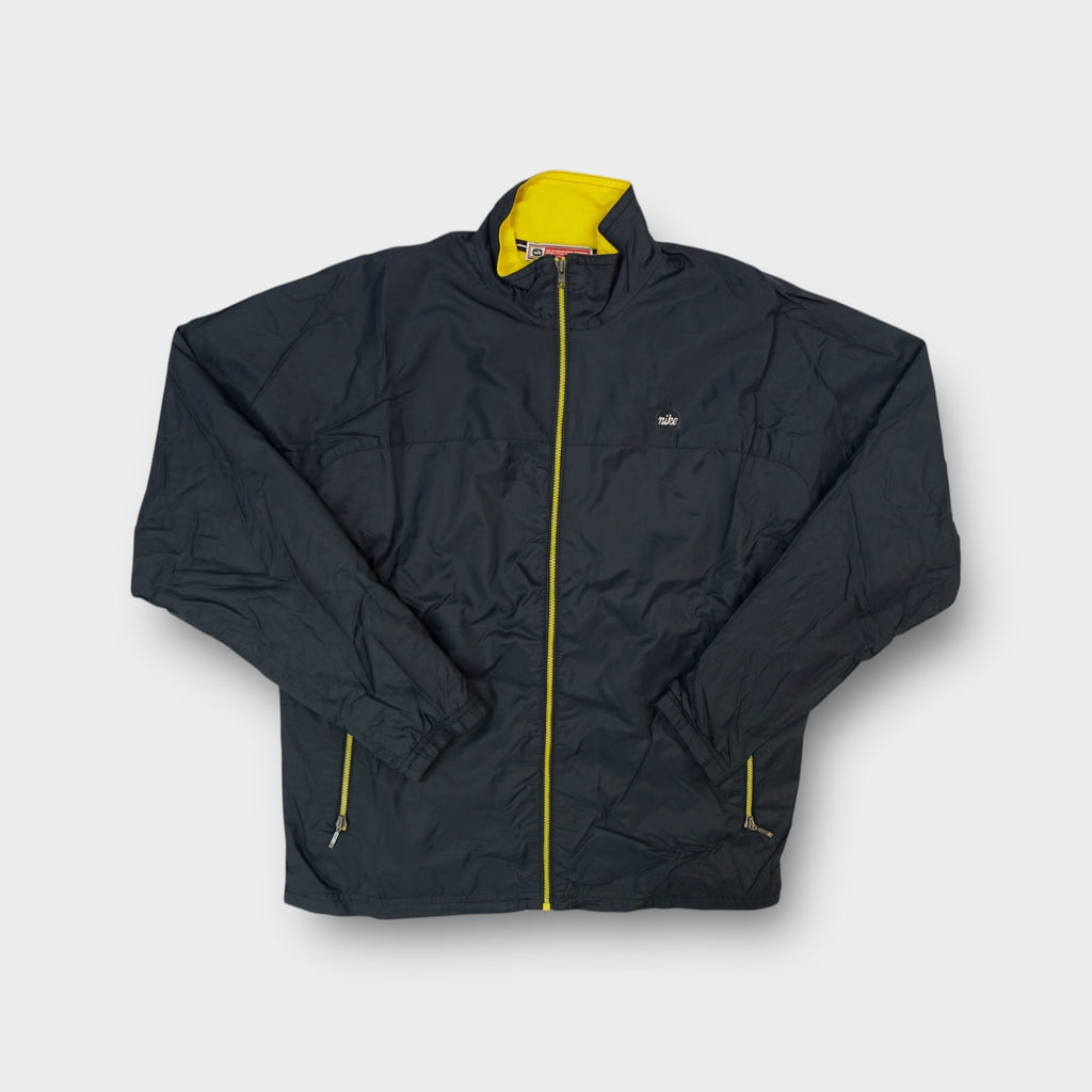 Nike track jacket in grey with yellow inner collar and small cursive chest logo patch