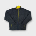 Nike track jacket in grey with yellow inner collar and small cursive chest logo patch