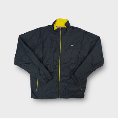 Nike track jacket in grey with yellow inner collar and small cursive chest logo patch