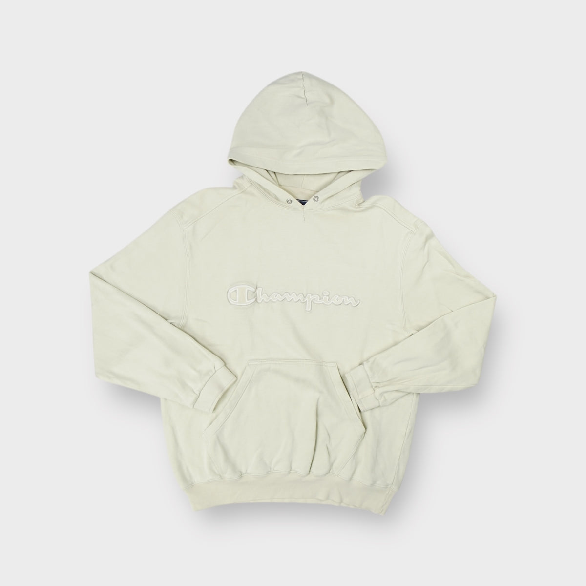Champion sweater hoodie in beige with embroidered raised logo script on the chest.