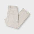 Nike beige golf trousers featuring front pleats and folded cuffed hems