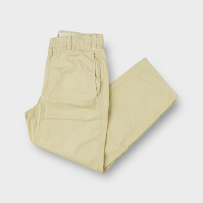 C.P. Company trousers in beige featuring side entry pockets and elastic waist inserts