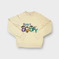 Adidas yellow crewneck sweater featuring a front Sport Goofy print with Trefoil logo.