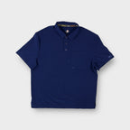Dickies polo shirt in blue featuring a chest pocket and buttoned collar