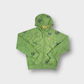 Green Nike full-zip hooded jacket featuring Misha Hollenbach cartoon graphic print