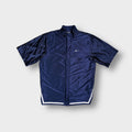 Nike shirt in navy blue with a small white embroidered swoosh logo on chest