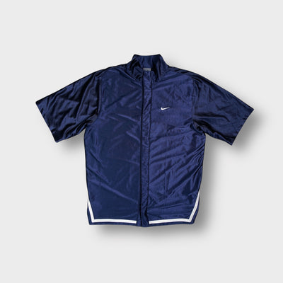 Nike shirt in navy blue with a small white embroidered swoosh logo on chest